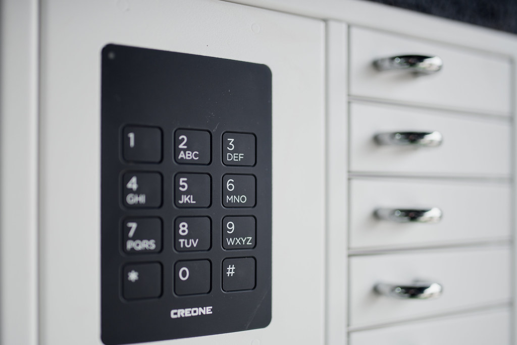Keypad on a modern drawer cabinet for secure access in a minimalistic office setting